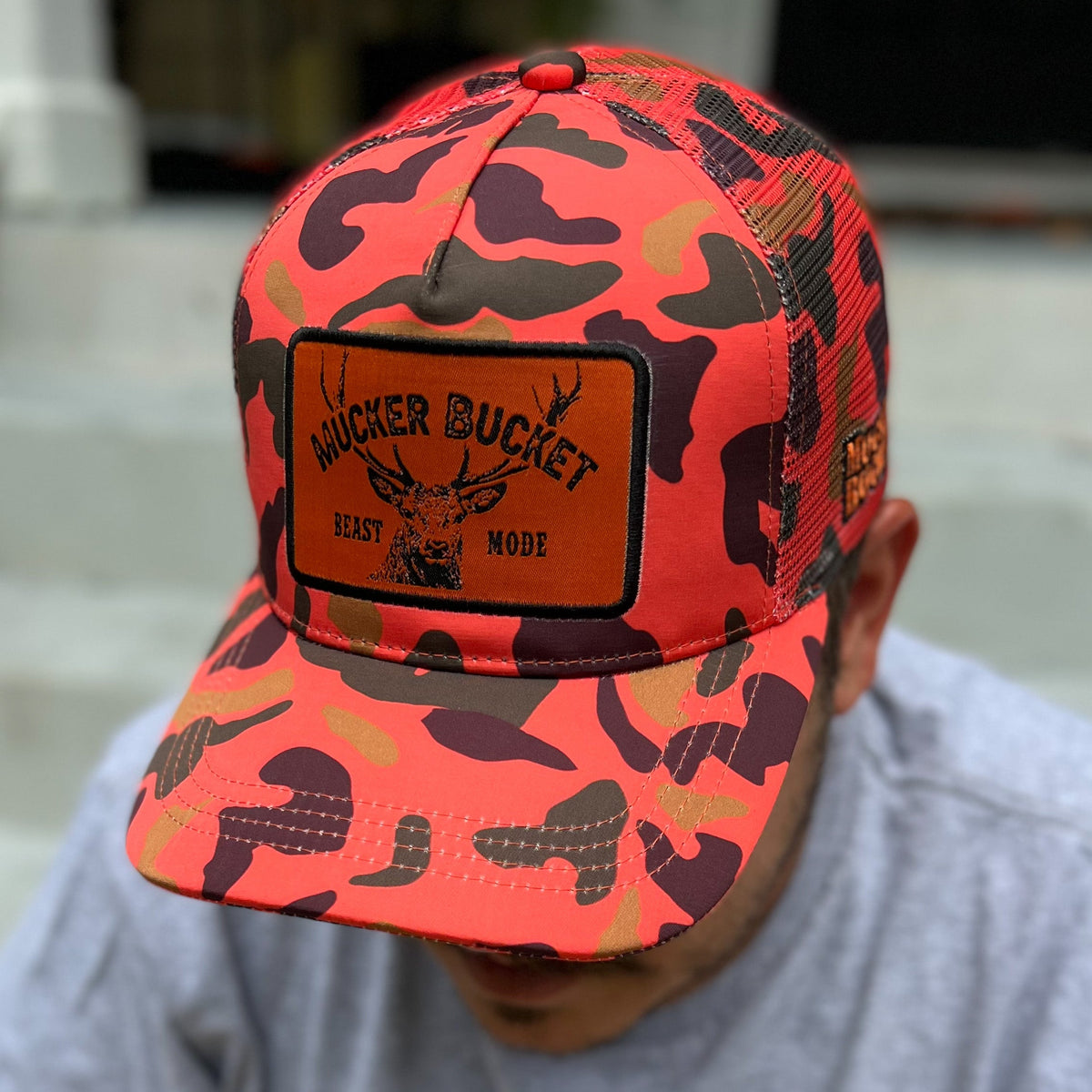 Mucker Bucket Beast Mode Orange Camo Trucker Bucket Hat