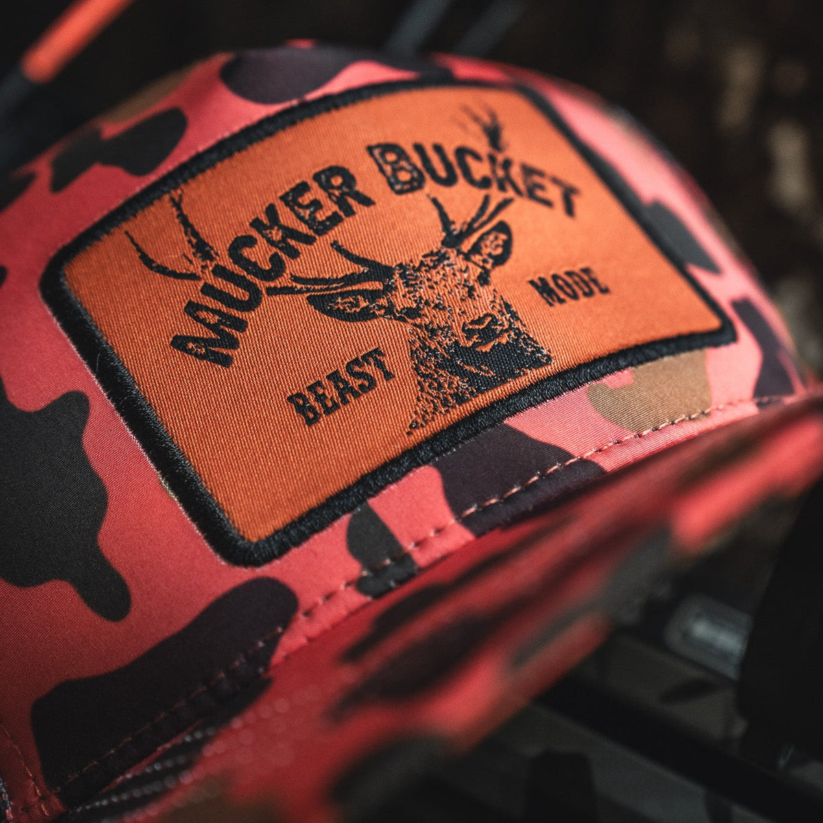 Mucker Bucket Beast Mode Orange Camo Trucker Bucket Hat